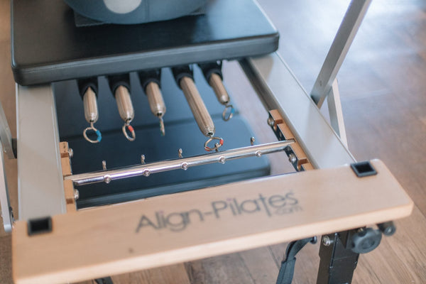 Close-up of reformer springs and the gear bar
