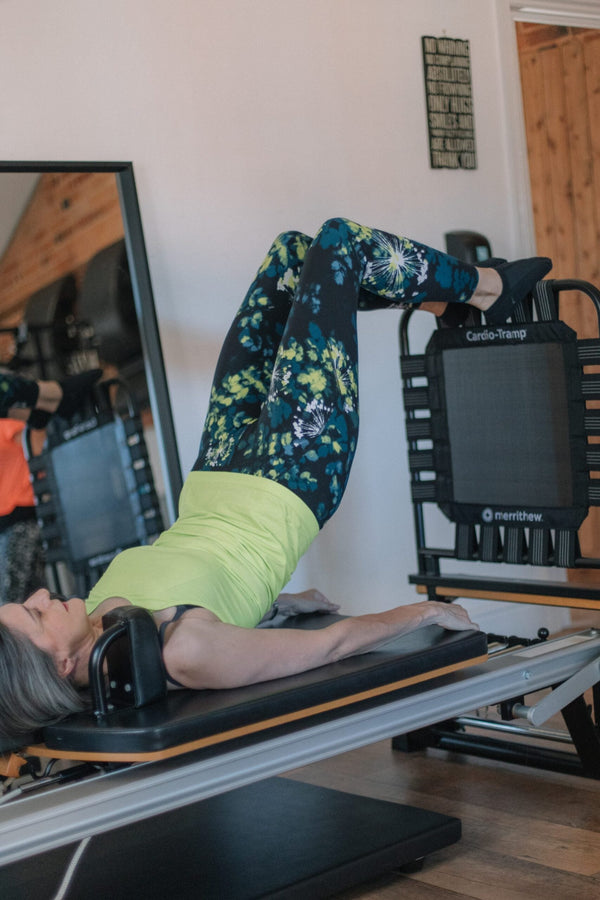 Client bridging with feet on the Cardio-Tramp jumpboard