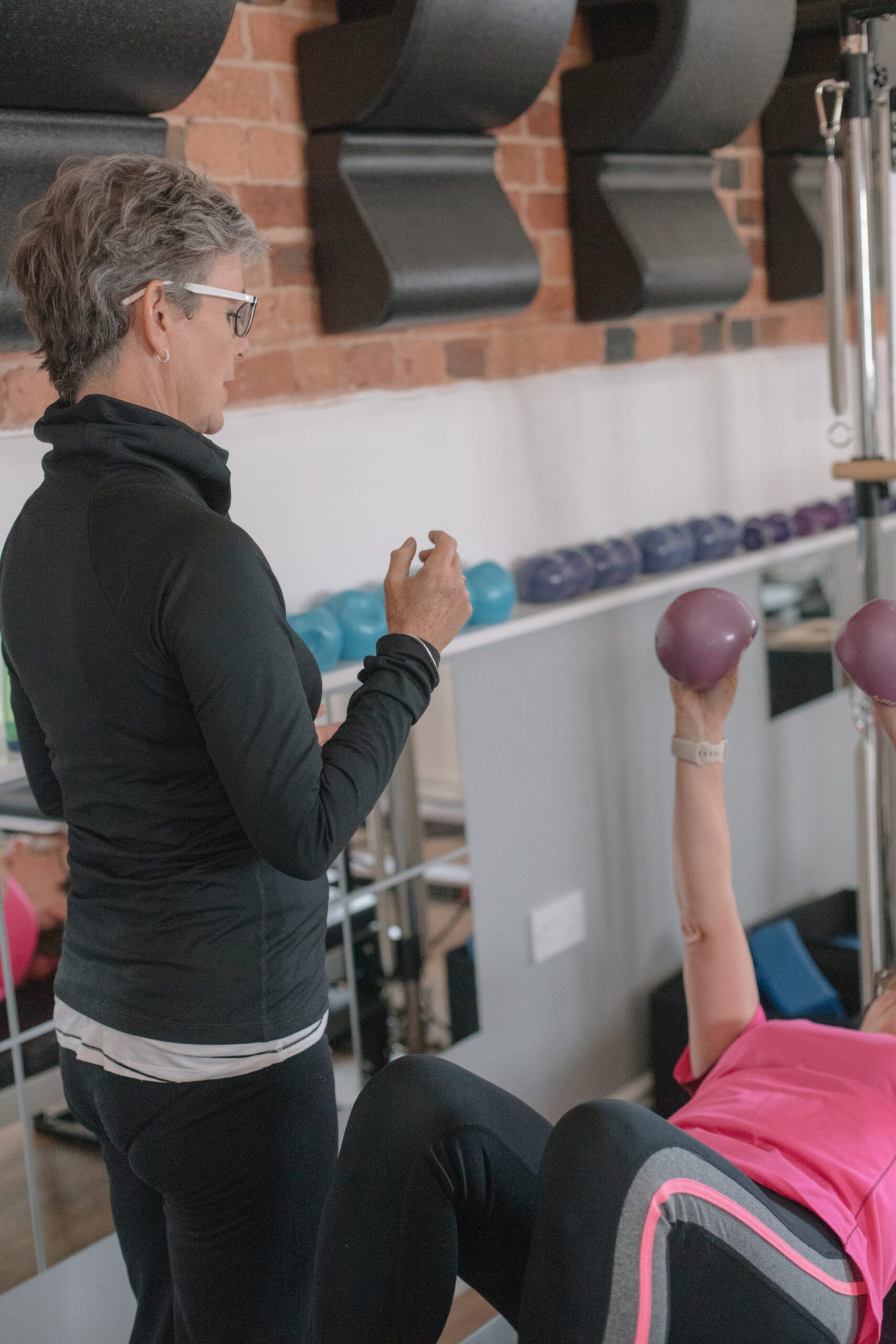 Weighted ball Pilates exercise at The Old Dairy Pilates Studio